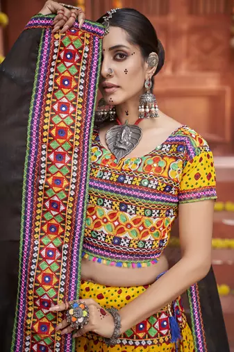 Yellow Colored Gamthi And Mirror Work On Patola Print Mix Cotton Silk Lehenga Choli For Navratri Garba