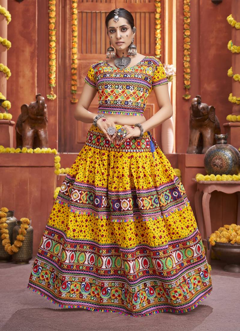 Yellow Colored Gamthi And Mirror Work On Patola Print Mix Cotton Silk Lehenga Choli For Navratri Garba