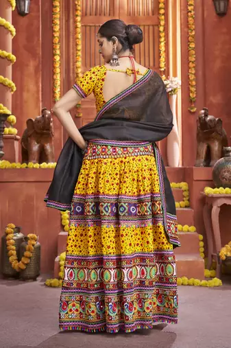 Yellow Colored Gamthi And Mirror Work On Patola Print Mix Cotton Silk Lehenga Choli For Navratri Garba