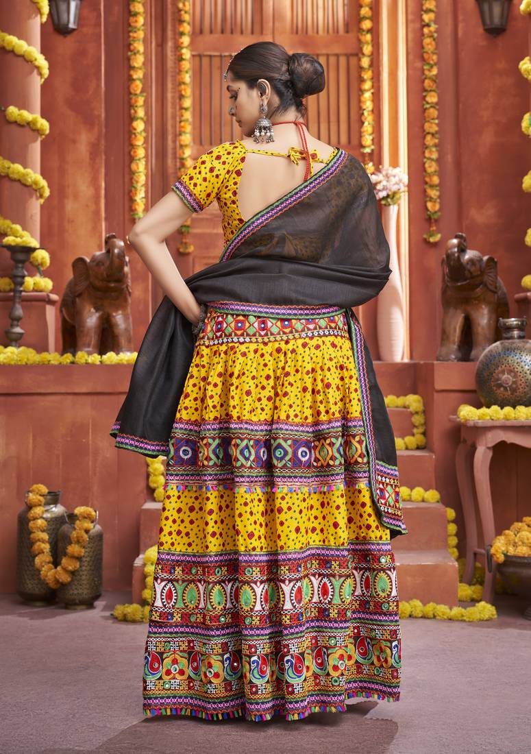 Yellow Colored Gamthi And Mirror Work On Patola Print Mix Cotton Silk Lehenga Choli For Navratri Garba