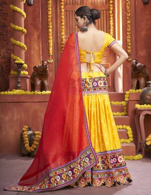 Yellow Gamthi And Mirror Work On Patola Print Mix Cotton Silk Lehenga Choli For Navratri Garba 4