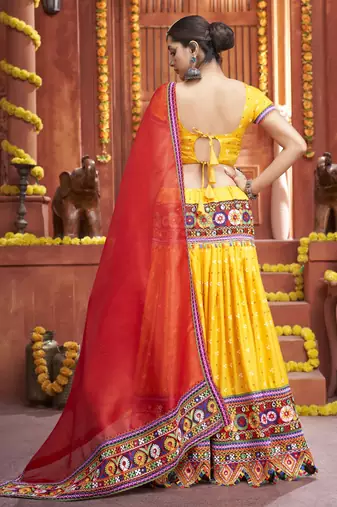 Yellow Gamthi And Mirror Work On Patola Print Mix Cotton Silk Lehenga Choli For Navratri Garba