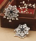 White Floral Shaped Earrings With Black Stone