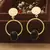 Round Gold Earrings With Black Stone