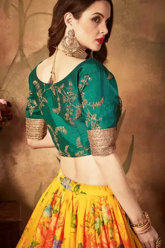 YELLOW & GREEN COLORED DORI, ZARI, AND SEQUINS EMBROIDERED & DIGITAL FLORAL PRINTED ORGANZA PARTY WEAR LEHENGA