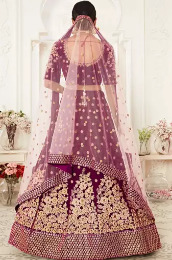 ENGAGING PURPLE ZARI, SEQUINS AND THREAD EMBROIDERED VELVET FABRIC LEHENGA CHOLI FOR DULHAN
