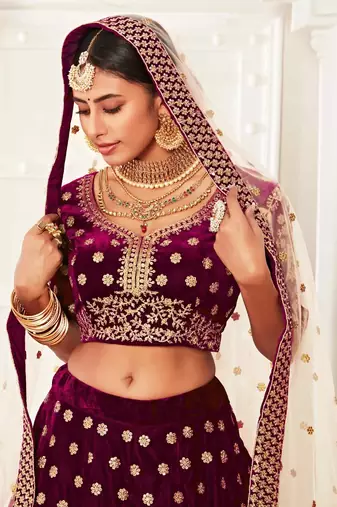 ENGAGING PURPLE ZARI, SEQUINS AND THREAD EMBROIDERED VELVET FABRIC LEHENGA CHOLI FOR DULHAN