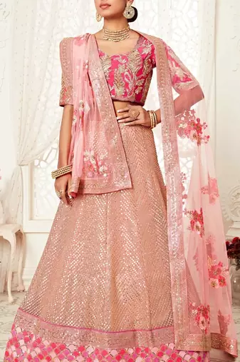 HYPNOTIZING PINK ZARI, SEQUINS AND THREAD EMBROIDERED DESIGNER NET FABRIC LEHENGA CHOLI