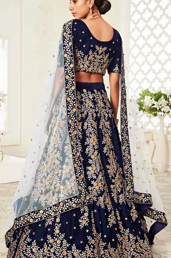 DELIGHTFUL NAVY-BLUE ZARI, SEQUINS AND THREAD EMBROIDERED VELVET FABRIC LEHENGA CHOLI FOR BRIDE