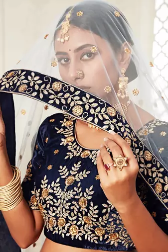 DELIGHTFUL NAVY-BLUE ZARI, SEQUINS AND THREAD EMBROIDERED VELVET FABRIC LEHENGA CHOLI FOR BRIDE