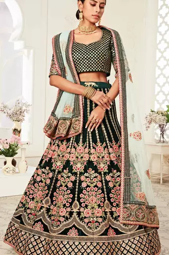 DELIGHTFUL DARK GREEN ZARI, SEQUINS AND THREAD EMBROIDERED VELVET FABRIC LEHENGA CHOLI FOR WEDDING