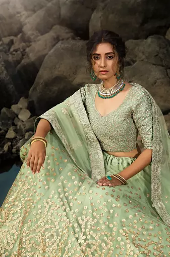 GREEN SEQUINS AND DORI EMBROIDERED SOFT NET FESTIVE & PARTY WEAR SEMI STITCHED LEHENGA