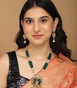 Mansiyaorange dark green matte gold temple theme maa lakshmi motif necklace set with earrings