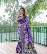 Sophisticated navy blue colour dola silk saree with smart woven designer and ethnic shibori print