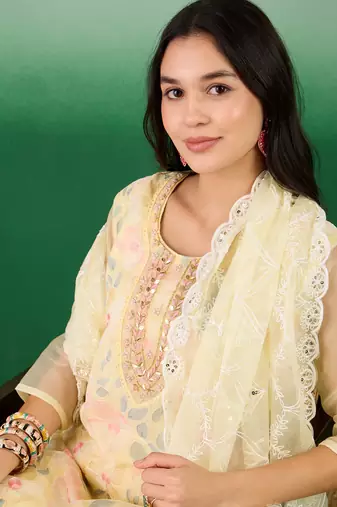 Beautifully embroidered yellowcolour organza fabric smart partywear ethnic suit