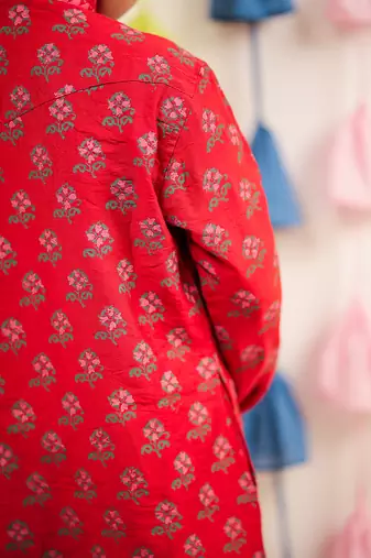 Red block printed kurta set.
