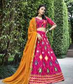 Seductive Rani Pink Colored Thread & Sequins Embroidered Silk Lehenga choli with Mustared Yellow Georgette Dupatta