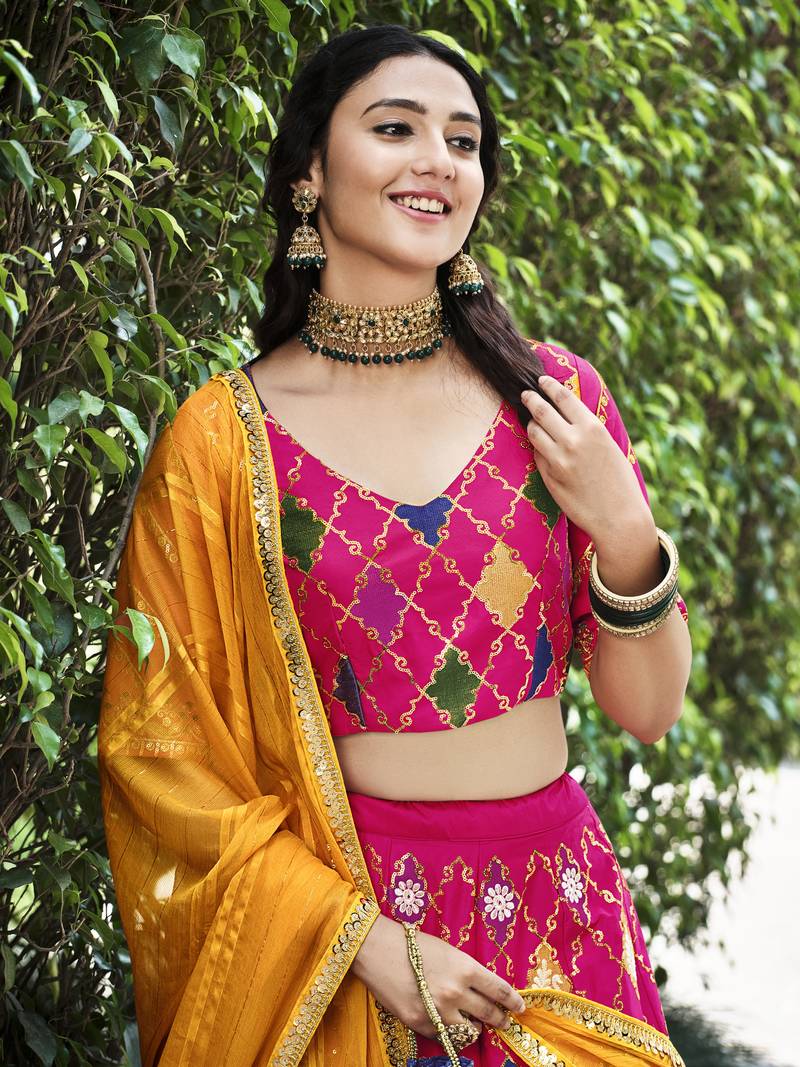 Seductive Rani Pink Colored Thread & Sequins Embroidered Silk Lehenga choli with Mustared Yellow Georgette Dupatta