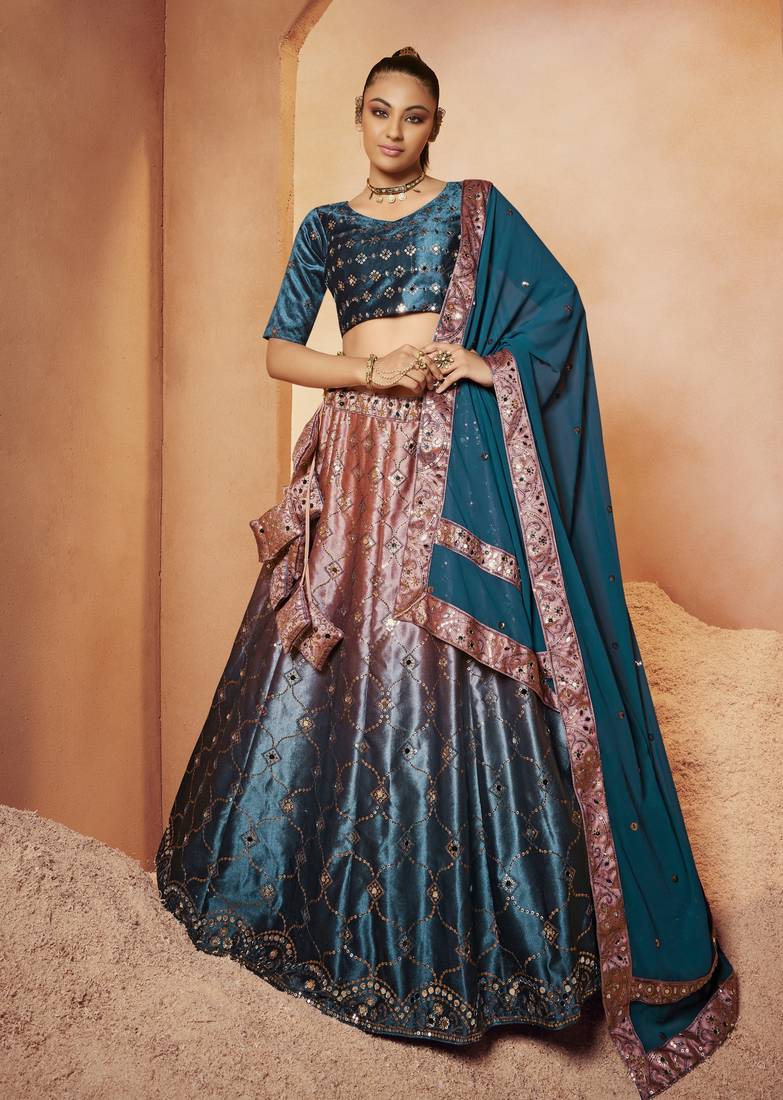 Marvelous Teal Blue Sequins Embroidered With All Over Mirror Work Velvet Party Wear Lehenga Choli