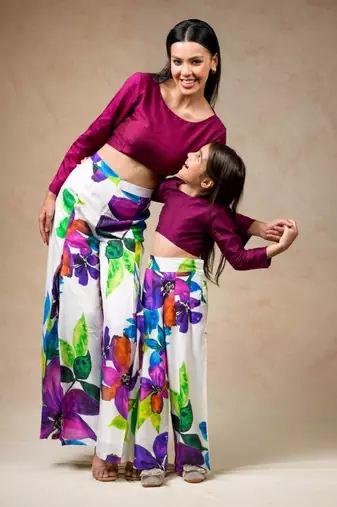 Modern floral print pleated pants with rich wine colored crop top