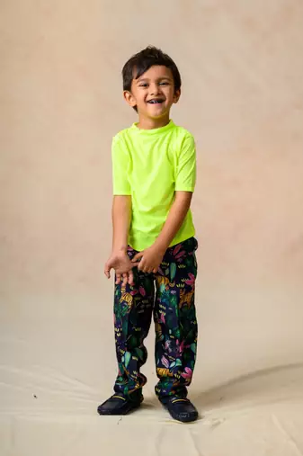 Jungle print coat with loose fitted straight pants and neon stretchable round neck t shirt