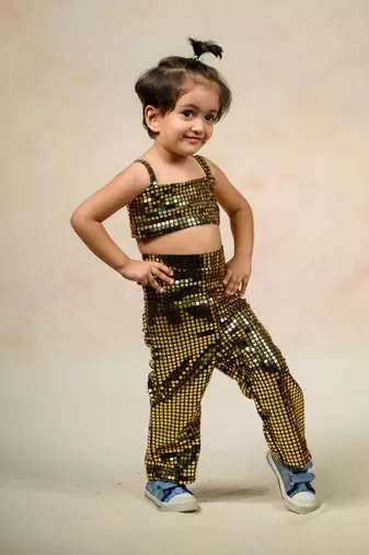 Antique gold metallic tube top with a metallic pants and  flaming lily print short jacket