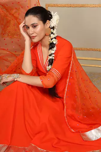 Saadgi orange mirror work anarkali set