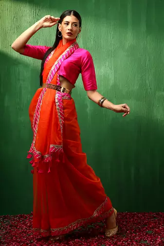 Adaa pink border orange organza saree