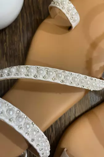 White embroidered flats