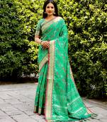 Ethnic And Stylish Rama Ikkat Patola Woven Silk Blend Saree For Party Looks