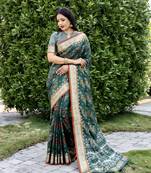 Ethnic And Stylish Green Ikkat Patola Woven Silk Blend Saree For Party Looks