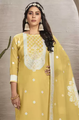 Sober and sophisticated yellow colour organza fabric girlish festive wear ethnic suit