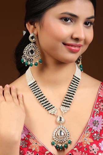 Anikas creation green jewellery set for a timeless statement