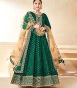 Green embroidered tapeta silk semi stitched anarkali suit