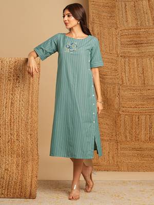 Embroidered a line dress in cotton stripe fabric with button detailing. 1
