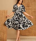Printed cotton flared dress with gathering and pocket.