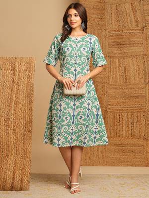A-line cotton ikat dress with front placket and buttons on front. 1