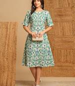 A-line cotton ikat dress with front placket and buttons on front.