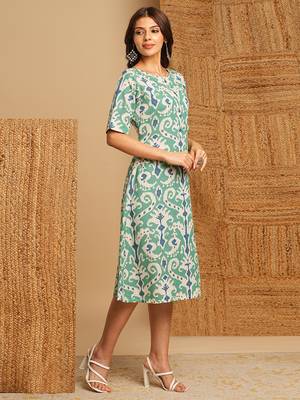 A-line cotton ikat dress with front placket and buttons on front. 3