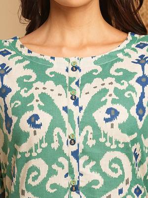 A-line cotton ikat dress with front placket and buttons on front. 4