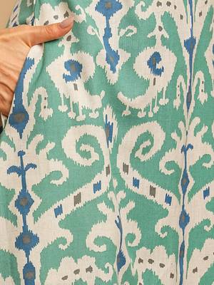A-line cotton ikat dress with front placket and buttons on front. 5