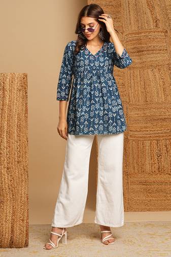 Cotton dhabu print top with gathering and hand embroidery.