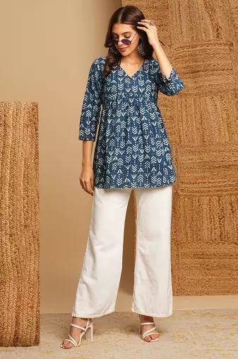 Cotton dhabu print top with gathering and hand embroidery.