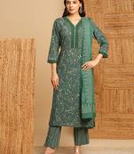 Green floral straight suit set with lace embellishment at the neckline and cuffs.