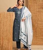 Dobby straight suit set with minimal block print and hand work.