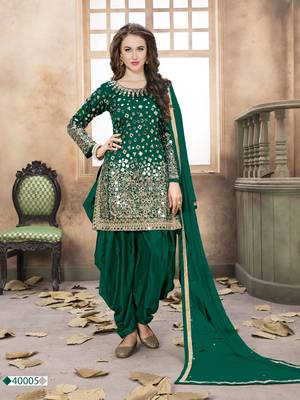 Dark green embroidered tapeta silk semi stitched salwar suit 1