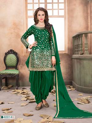 Green embroidered tapeta silk semi stitched salwar suit 1