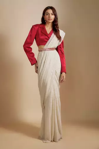 Red blazer with beige saree with embroiderd belt