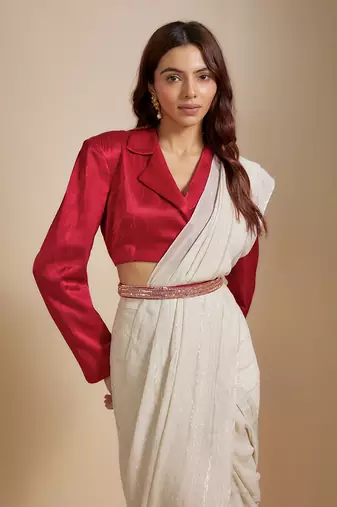 Red blazer with beige saree with embroiderd belt