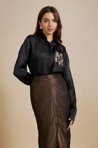 Black embroidered shirt with black skirt